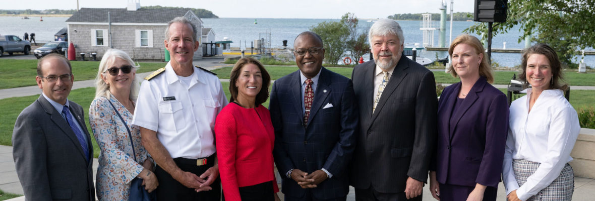 Rear Admiral McDonald, and administrators from the state and Mass Life Sciences stand outside of Mass Maritime