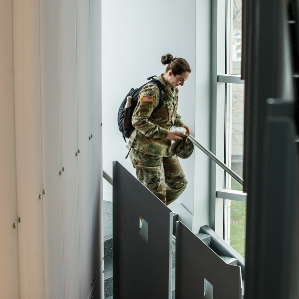 girl in army uniform in the library