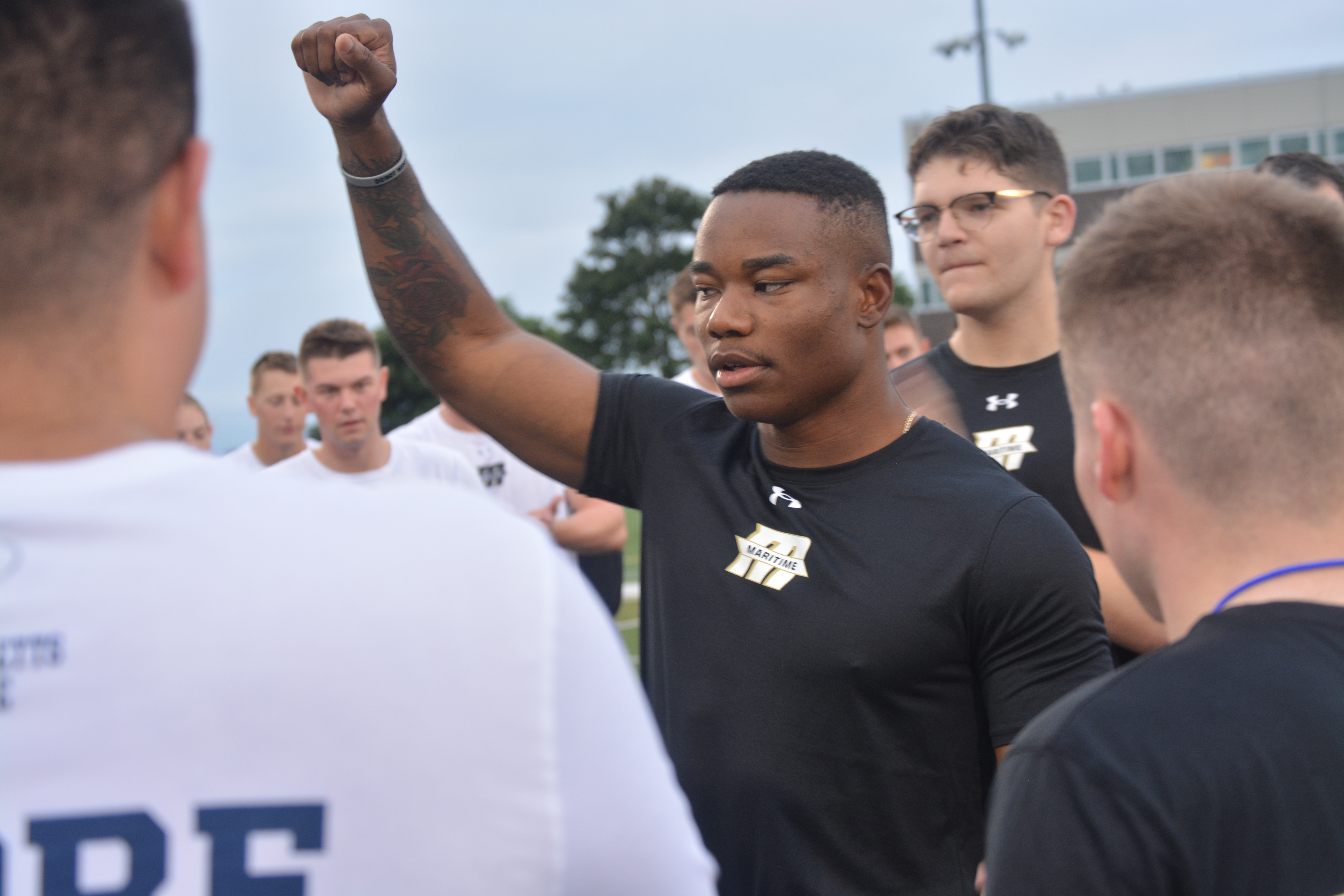 1/C Copeland motivating the regiment during PT