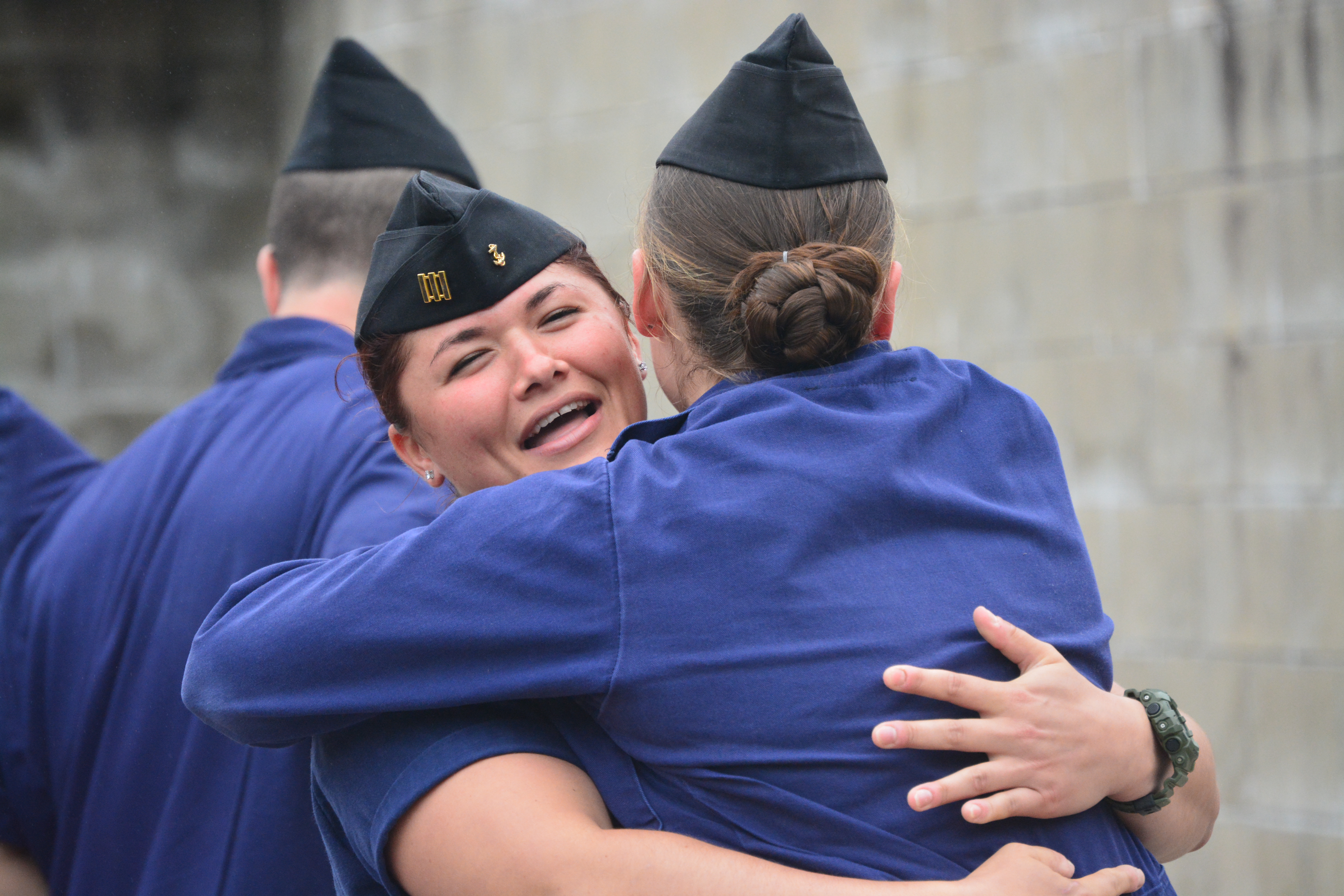 1/C Strano and 1/C Atkins embrace