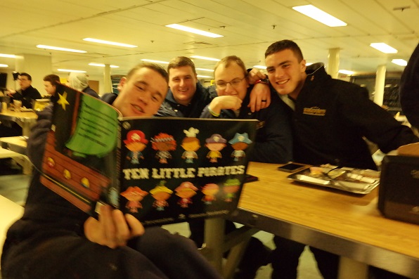 cadets reading book in mess deck
