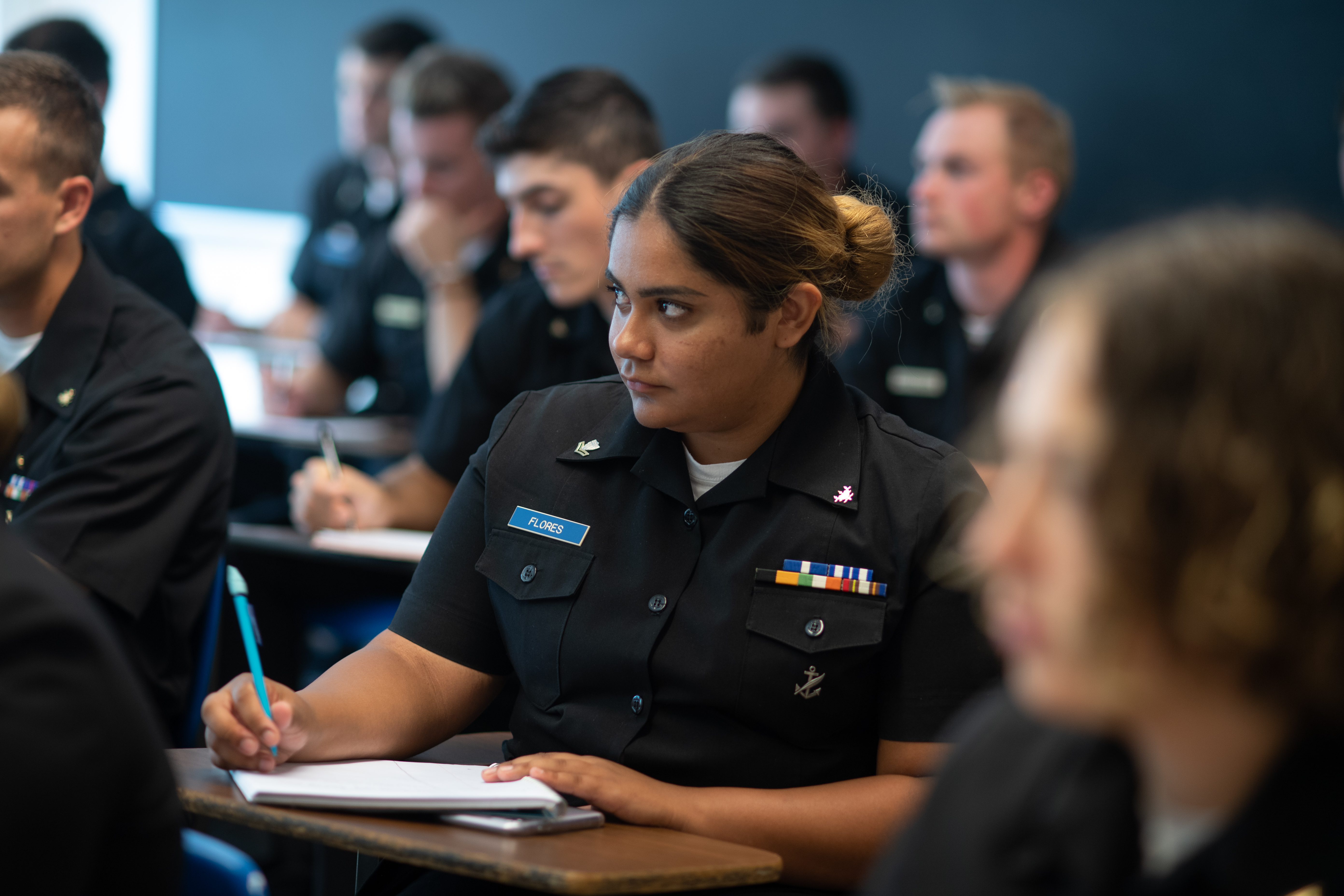 Cadet in class taking notes