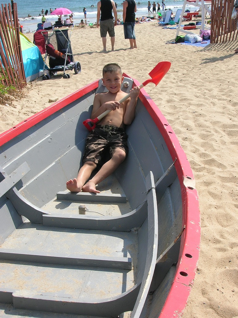 young Nicholas on a boat