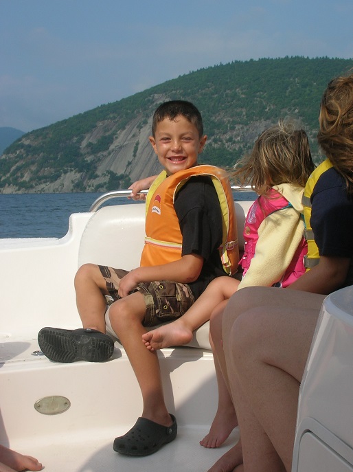 young Nick on a boat
