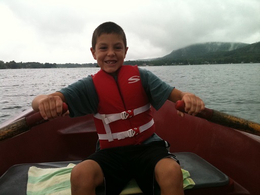 young Nick on a boat