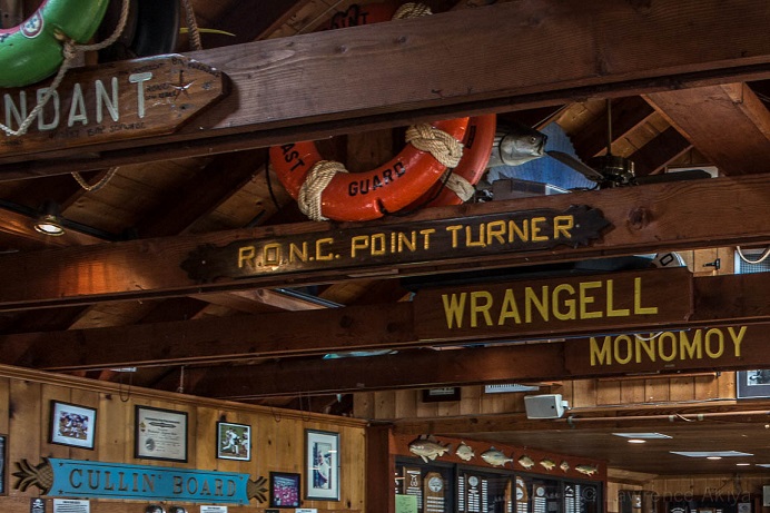 signs on ceiling of anglers club