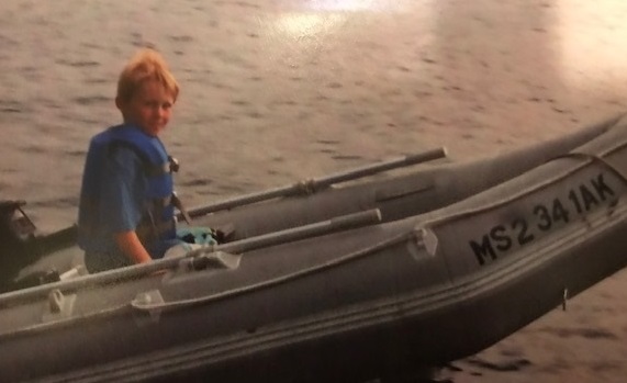young Brendan in a boat