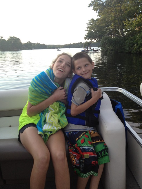 young Brett and his sister on a boat