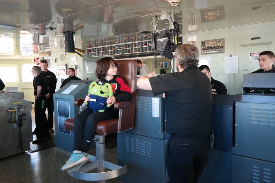 son in captain's chair with Bobby