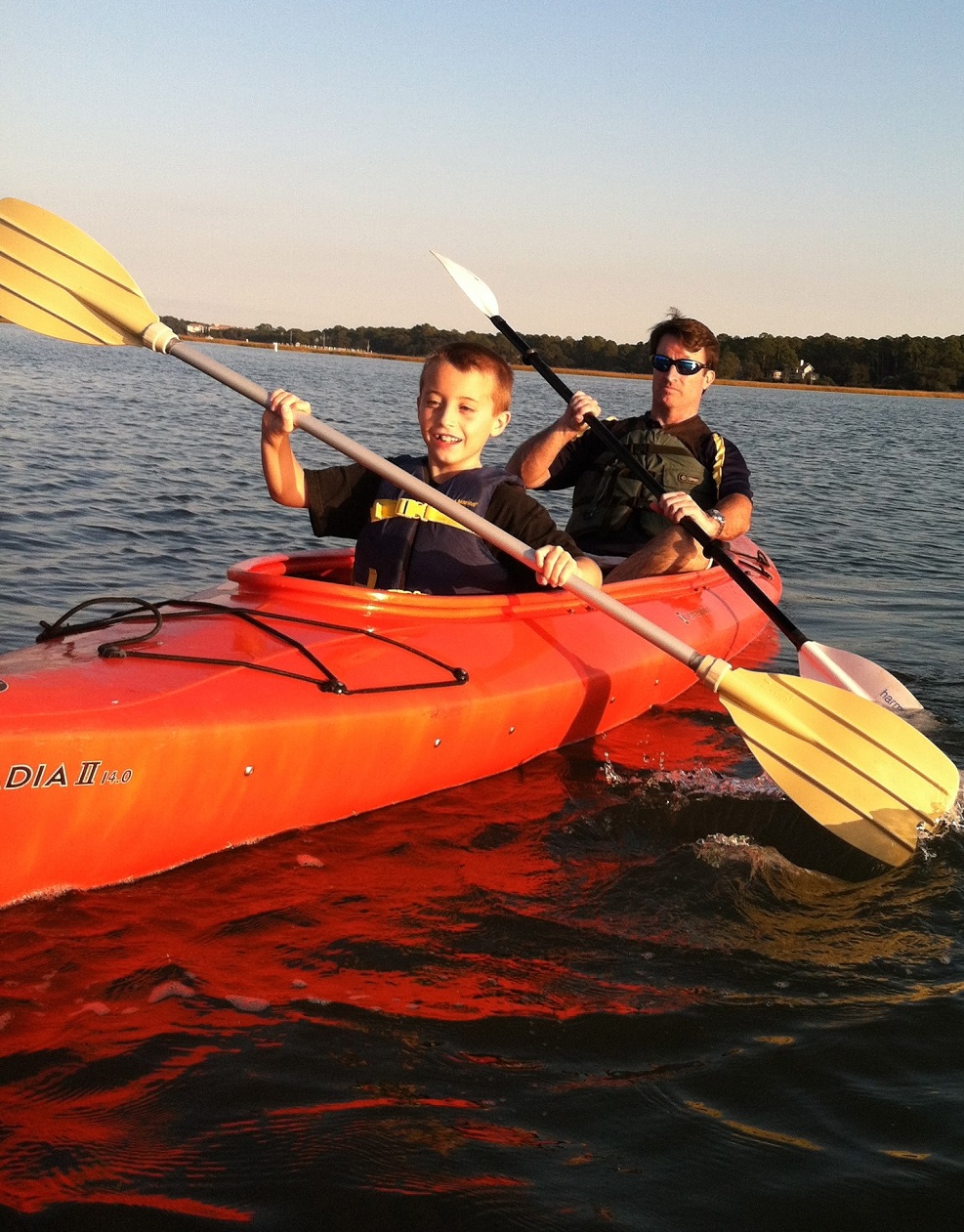 young Cam in a kayak