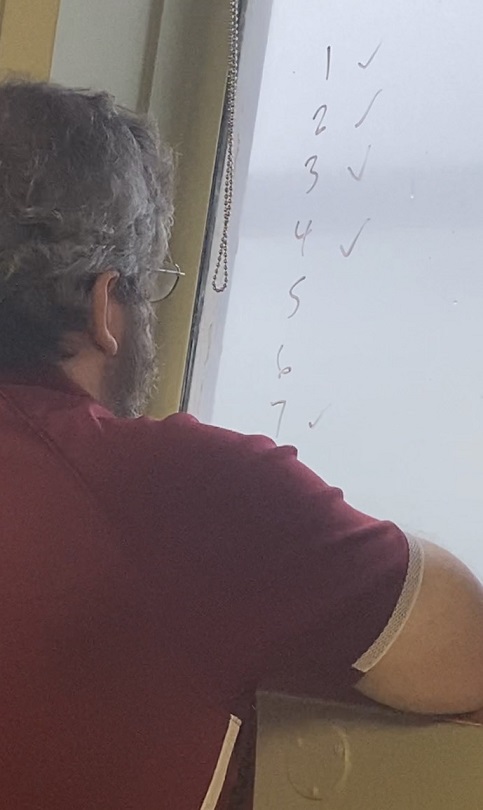 Captain writing on window