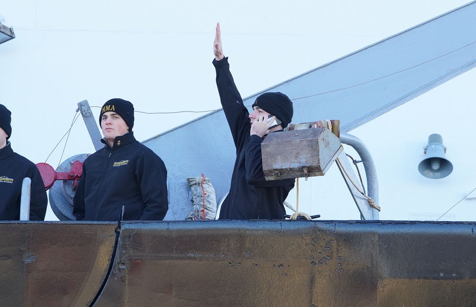 cadets wave goodbye from ship