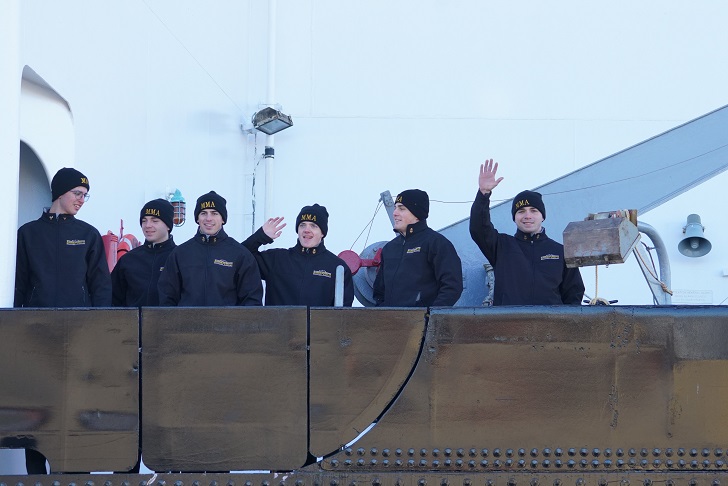 cadets wave goodbye from ship