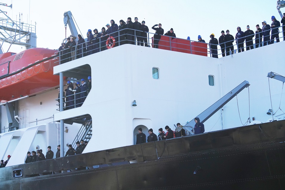 cadets wave goodbye from ship