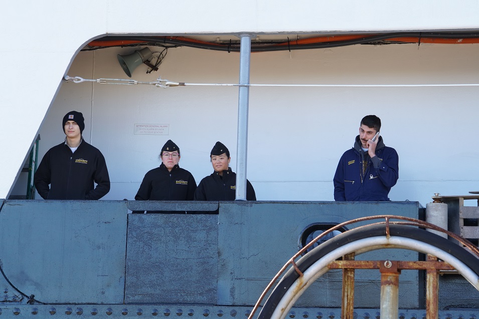 cadets wave goodbye from ship