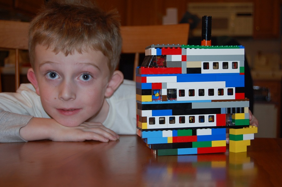 Daniel with a Lego boat