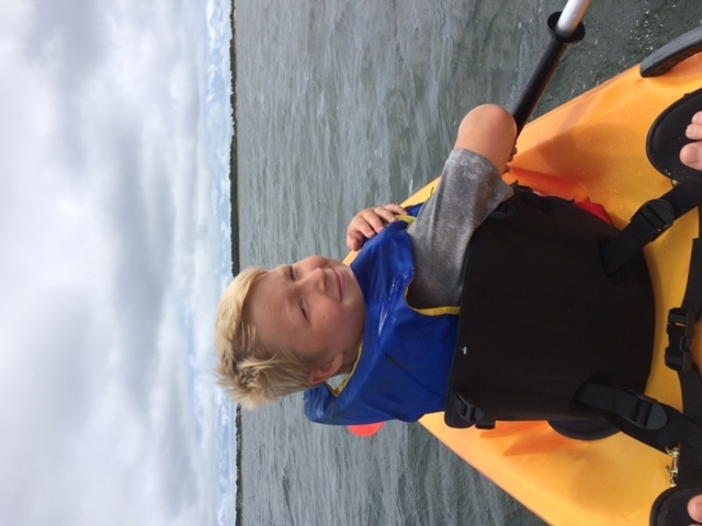 dean in a kayak wearing life jacket.