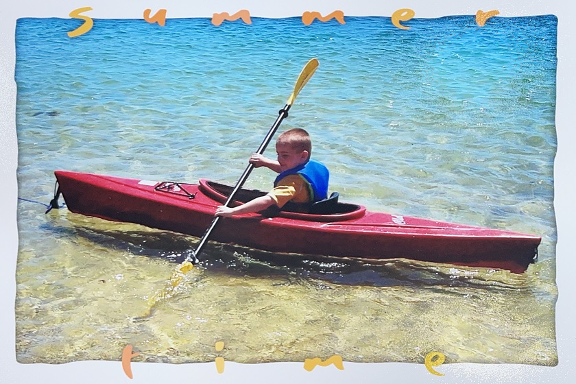 Liam in a red kayak