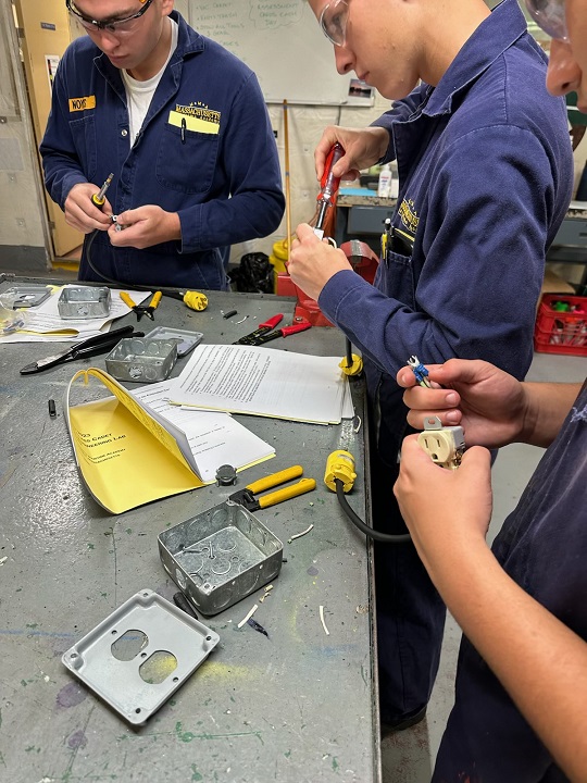 cadets in engine lab working with various tools