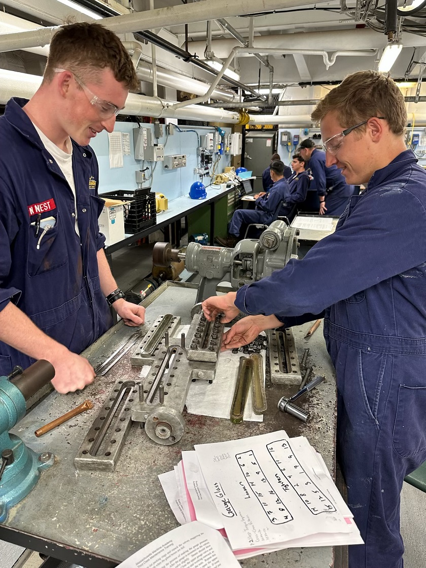 cadets in engine lab working with various tools