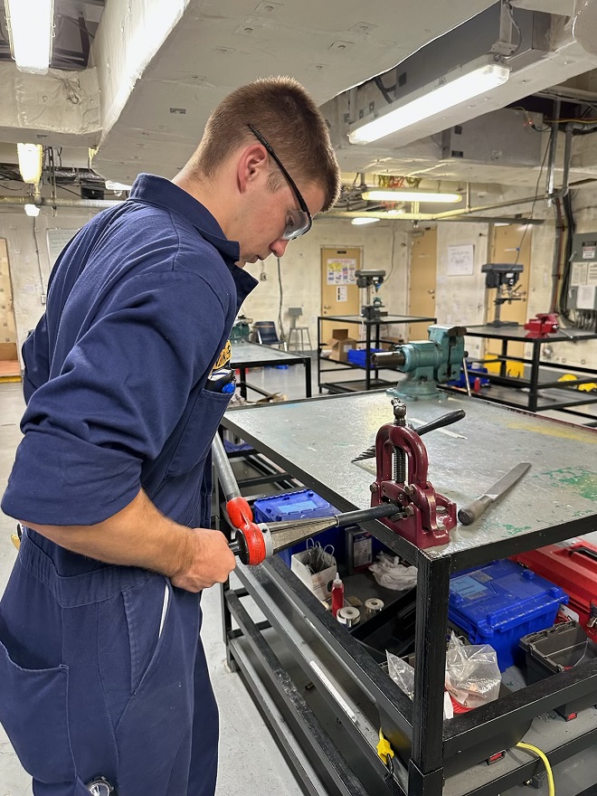 cadets in engine lab working with various tools