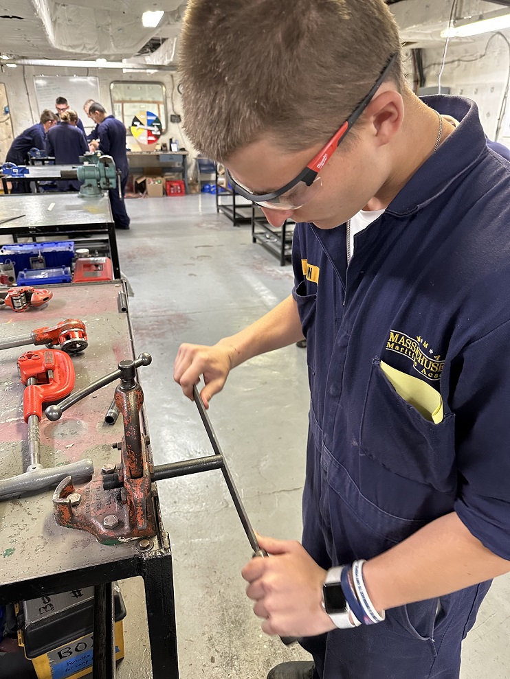 cadets in engine lab working with various tools