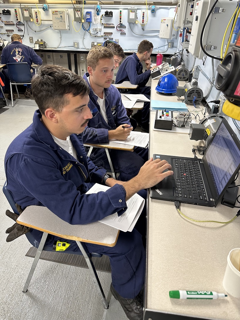 cadets in engine lab working with various tools