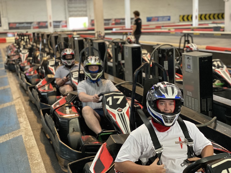 cadets in racing cars at track
