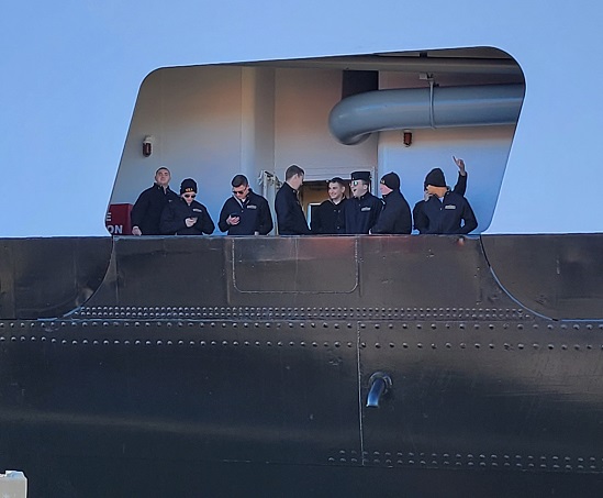 cadets wave goodbye from ship