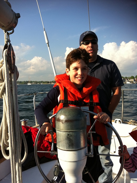 Gabriel sailing with his dad