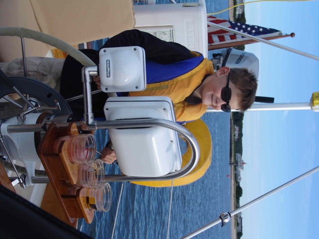 young Ian on the deck of a boat