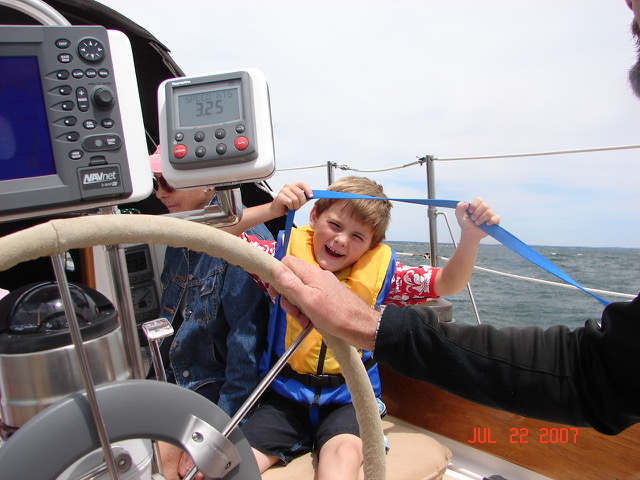young Ian on the deck of a boat
