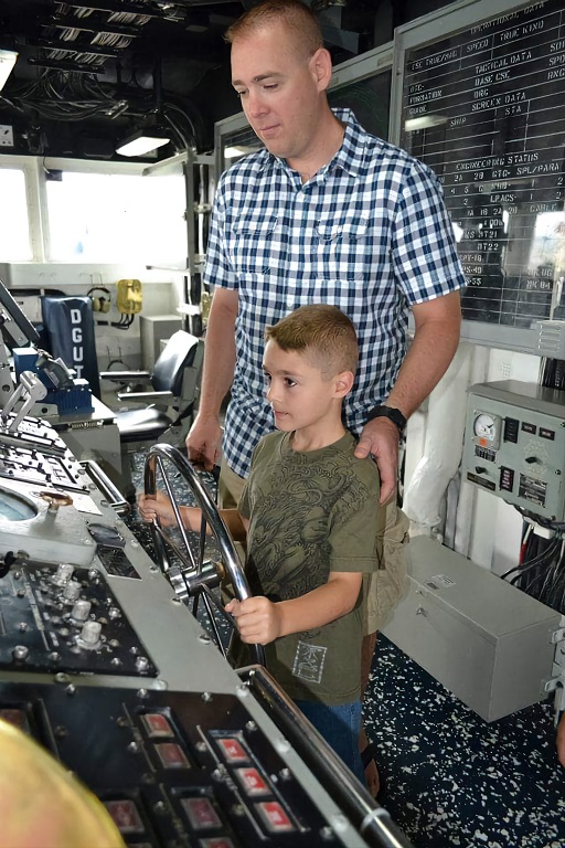 Kaleb on the bridge of his dad's sub.