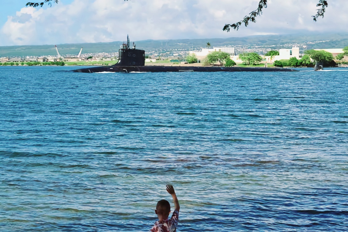 Kaleb waving goodbye to his dad's sub