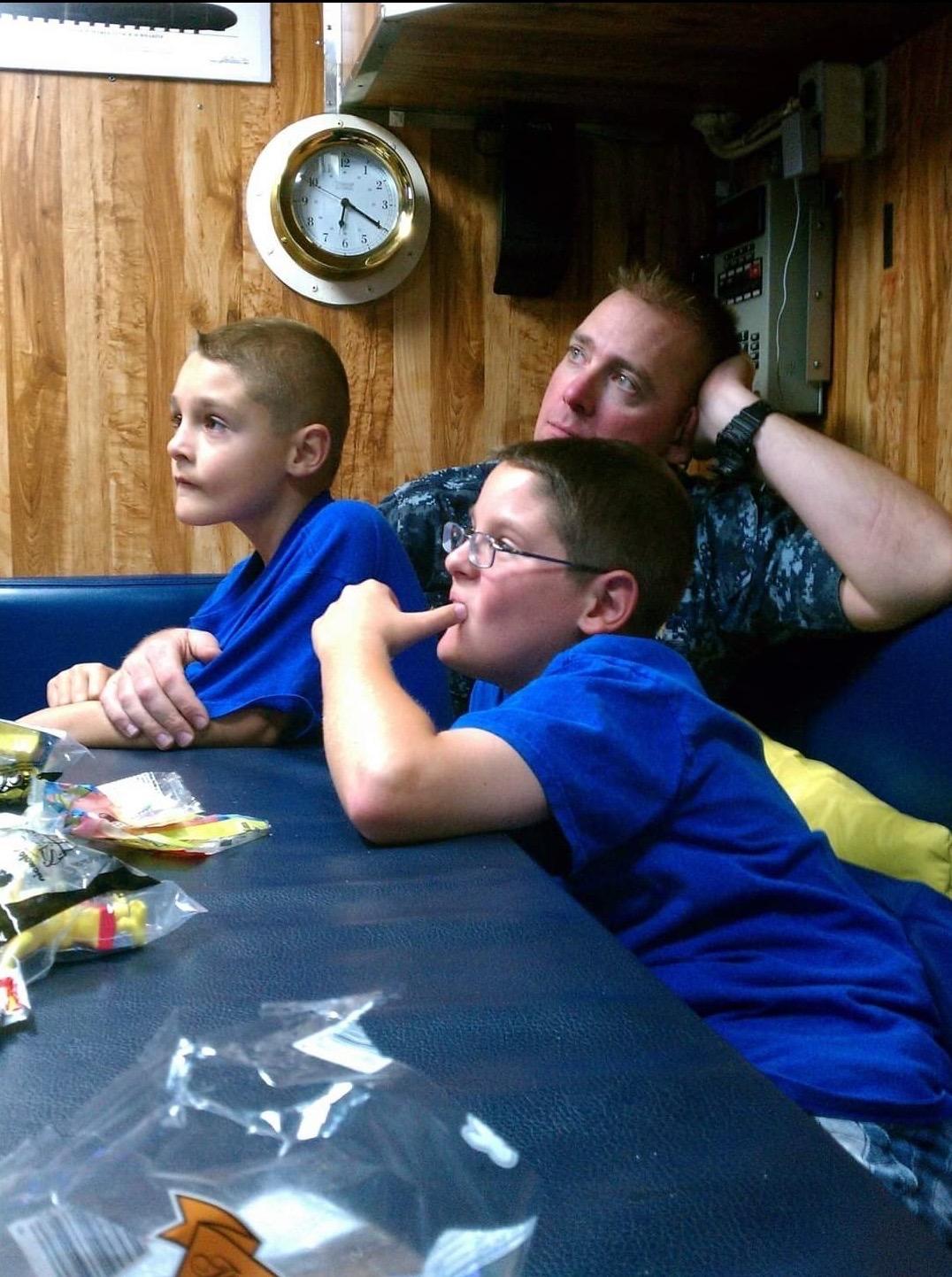 Kaleb, dad, and brother on the sub