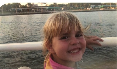 Krista watching a riverboat