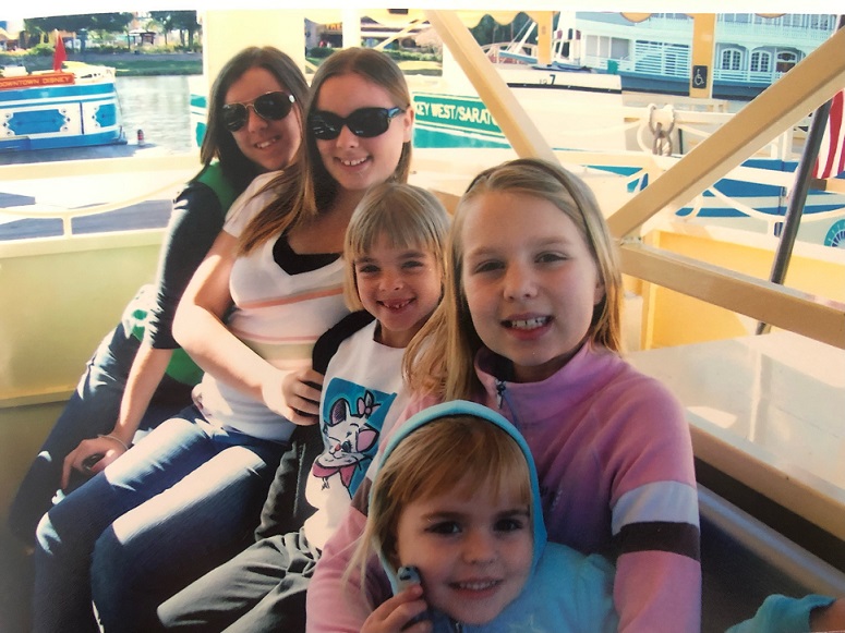 Krista on a boat with siblings