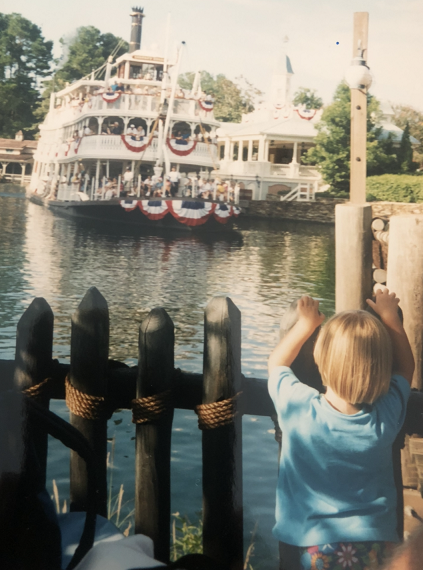 Krista watching a riverboat