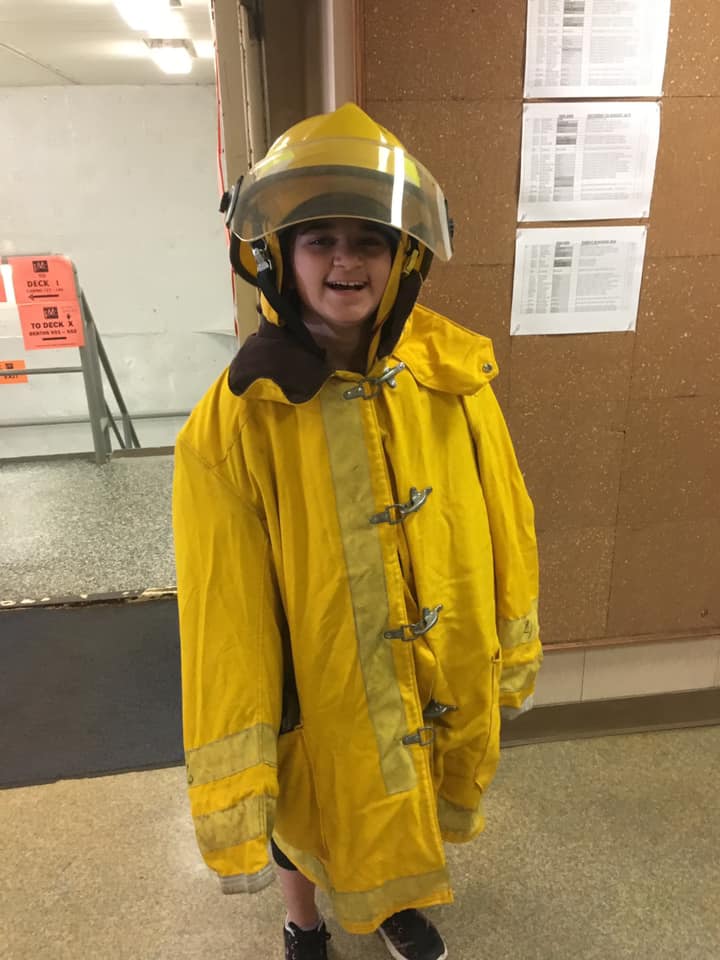 Kyrie in firefighting gear