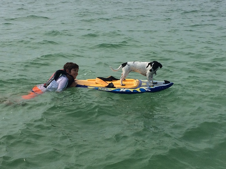 lucas on a small boat far from shore