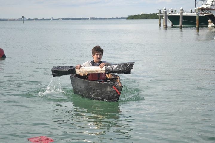 lucas in a cardboard boat