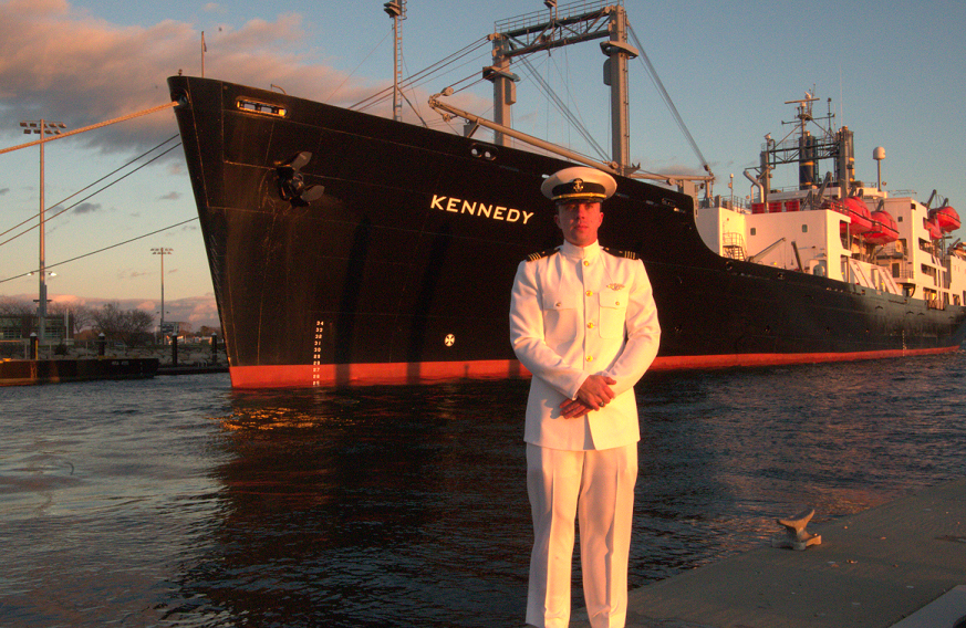 cadet in white uniform by ship