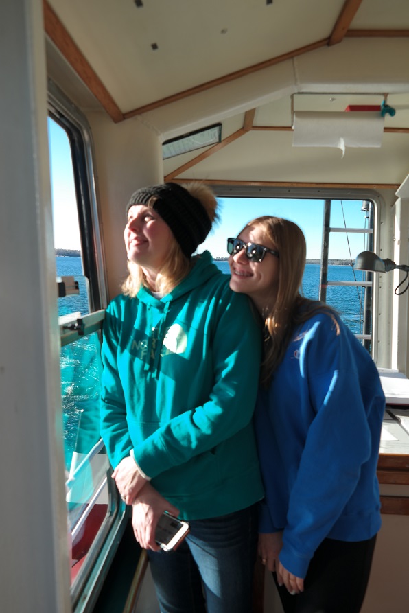 mom and sister on tug