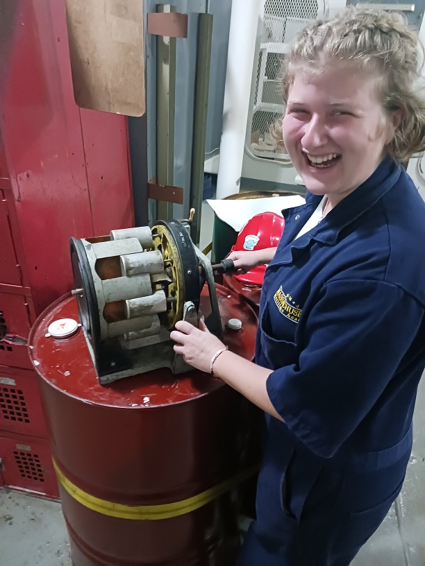 female cadets with a cylinder which is part of steering gear