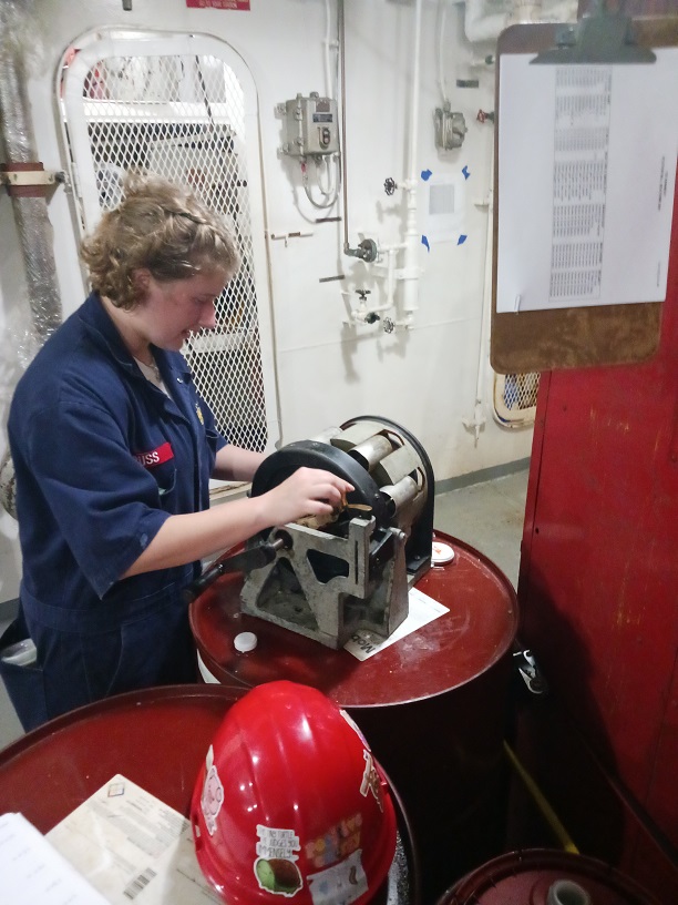 female cadets with a cylinder which is part of steering gear