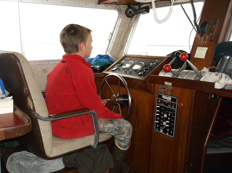 Nicholas on the bridge of a boat