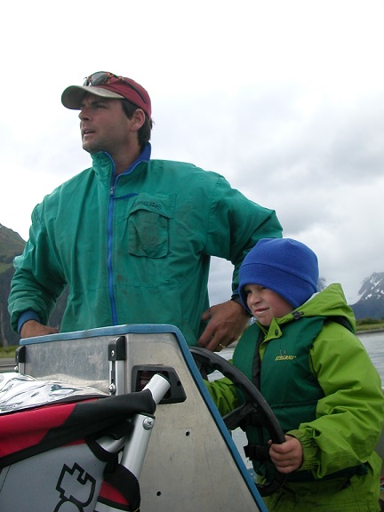 Nicholas and his dad on a boat