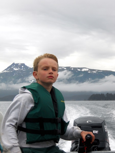 Nicholas driving a boat himself