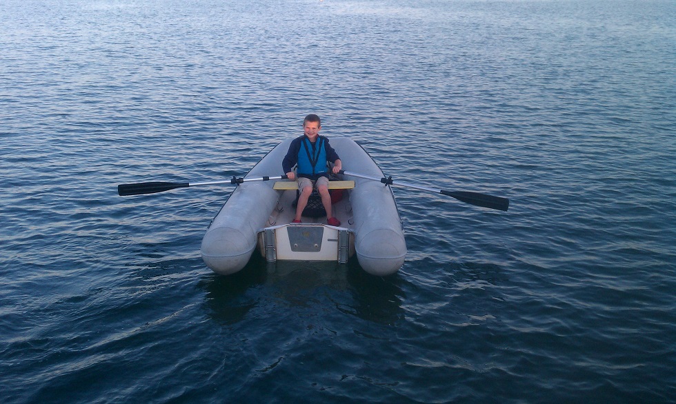 Nicholas in a boat