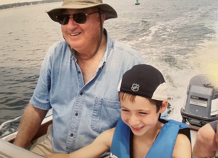 young Nick on a boat